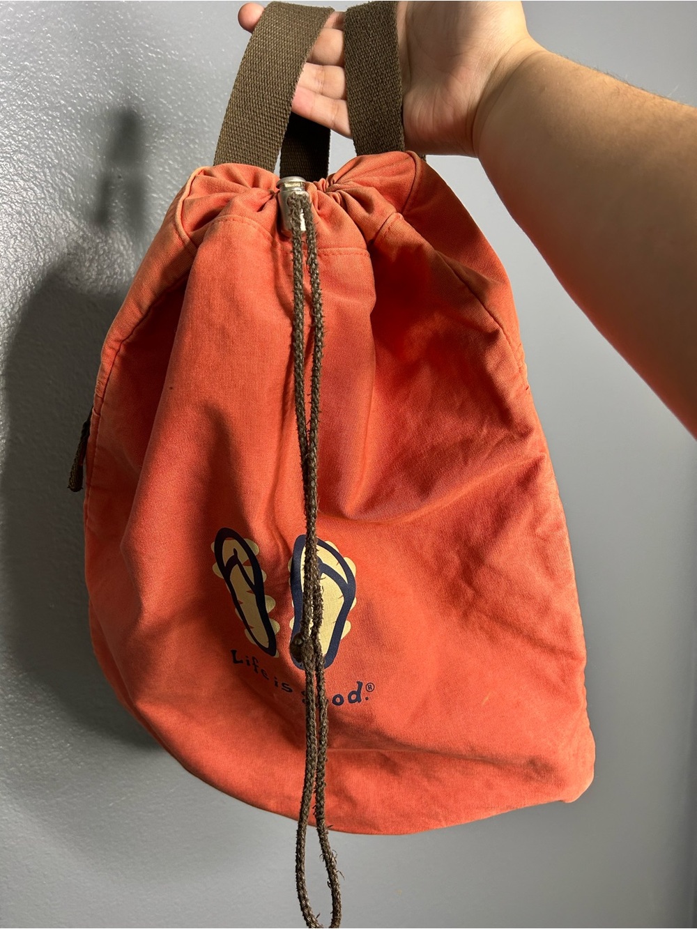 Life is Good Canvas Drawstring Backpack in Salmon with Flip-Flop Graphic
